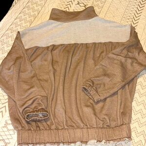 EUC taupe quarter zip top with unique back detail in size medium. Worn once